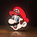 Front view of Super Mario LED lightbox sign glowing on a wooden desk