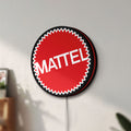 Unlit Mattel LED lightbox mounted on a wall in daylight