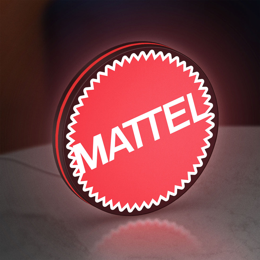 Mattel LED lightbox hanging on a wall with red glow