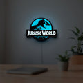 Jurassic World Dinosaur LED lightbox hanging on a room wall with soft blue light