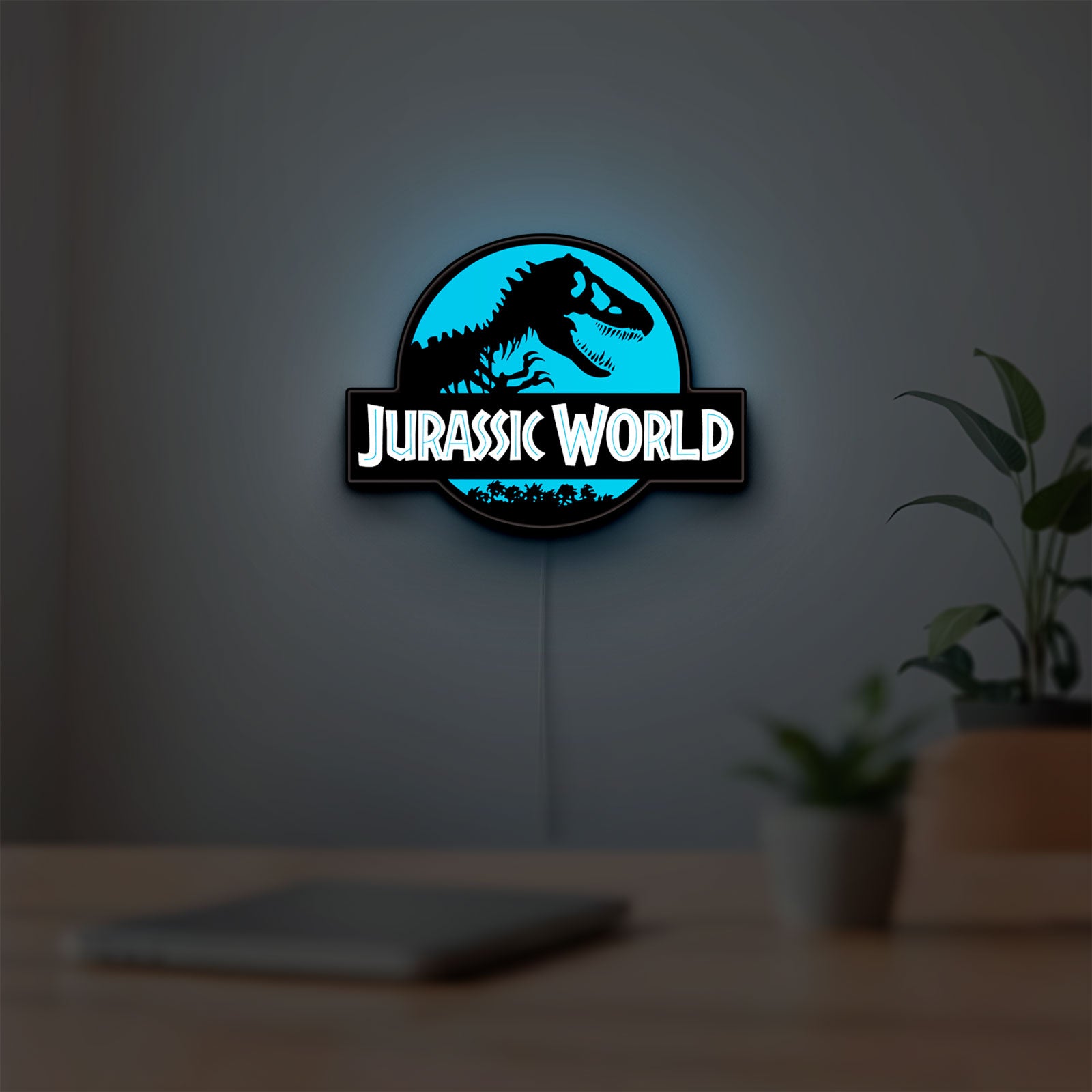 Jurassic World Dinosaur LED lightbox hanging on a room wall with soft blue light