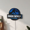 Unlit Jurassic World Dinosaur LED lightbox mounted on a wall in daylight