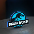 Jurassic World Dinosaur LED lightbox standing on a desk from an angled side view with blue glow
