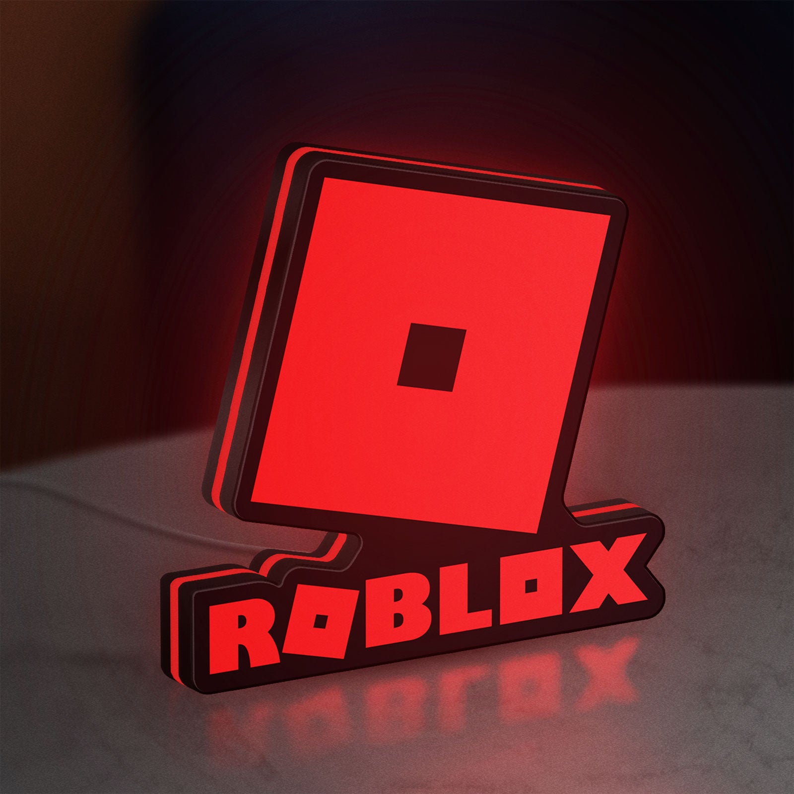 Roblox LED lightbox standing on a desk from an angled side view with red glow