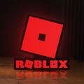 Front view of Roblox LED lightbox sign glowing on a wooden desk