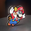Super Mario Bros 3 LED lightbox standing on a desk from an angled side view with white glow