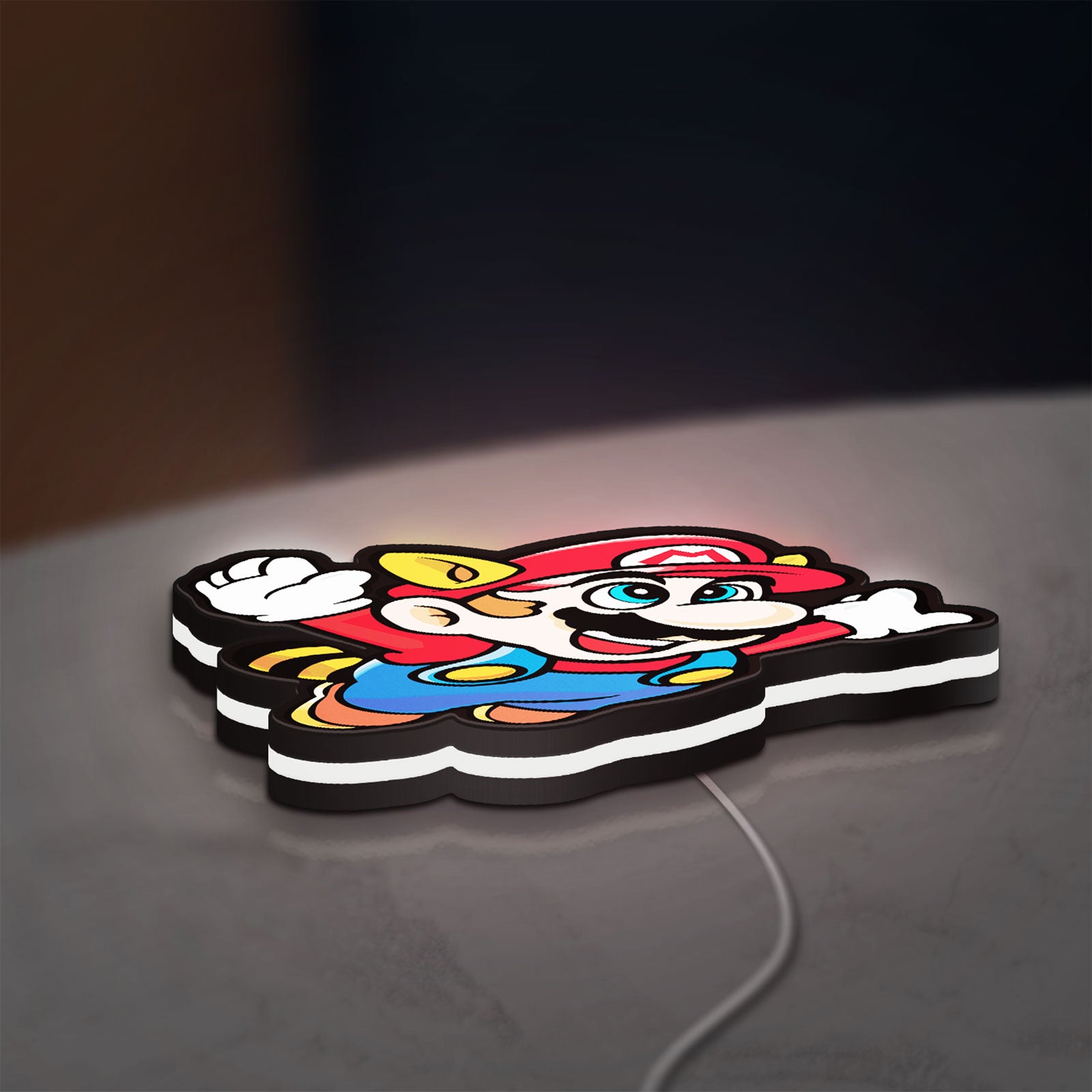 Super Mario Bros 3 LED lightbox lying flat on a desk with white glow