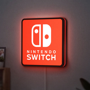 Nintendo Switch LED lightbox hanging on a wall with red glow
