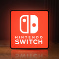Front view of Nintendo Switch LED lightbox sign glowing on a wooden desk