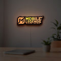 Mobile Legends LED lightbox hanging on a room wall with soft orange light