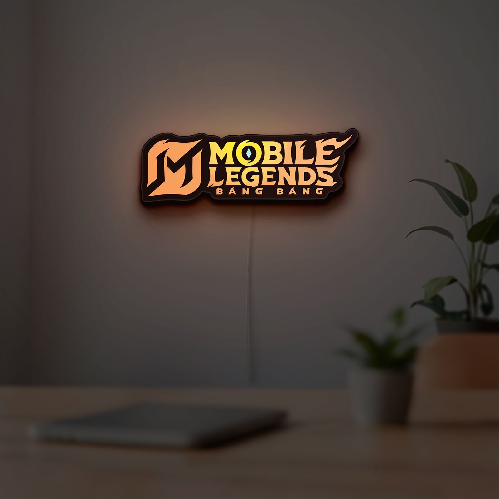 Mobile Legends LED lightbox hanging on a room wall with soft orange light
