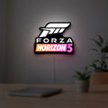 Forza Horizon 5 LED lightbox hanging on a room wall with soft white light