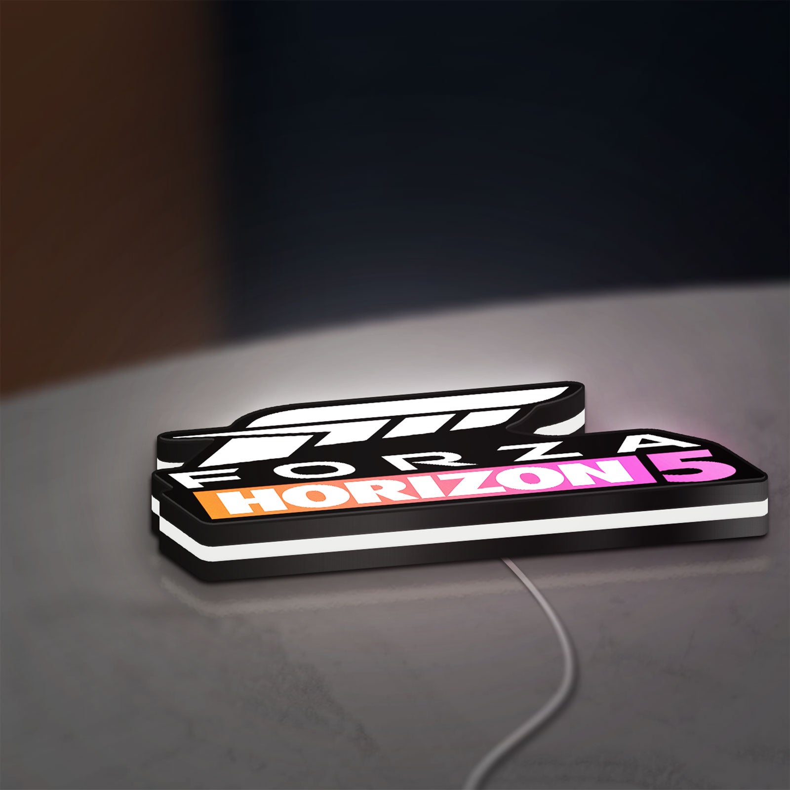 Forza Horizon 5 LED lightbox lying flat on a desk with white glow