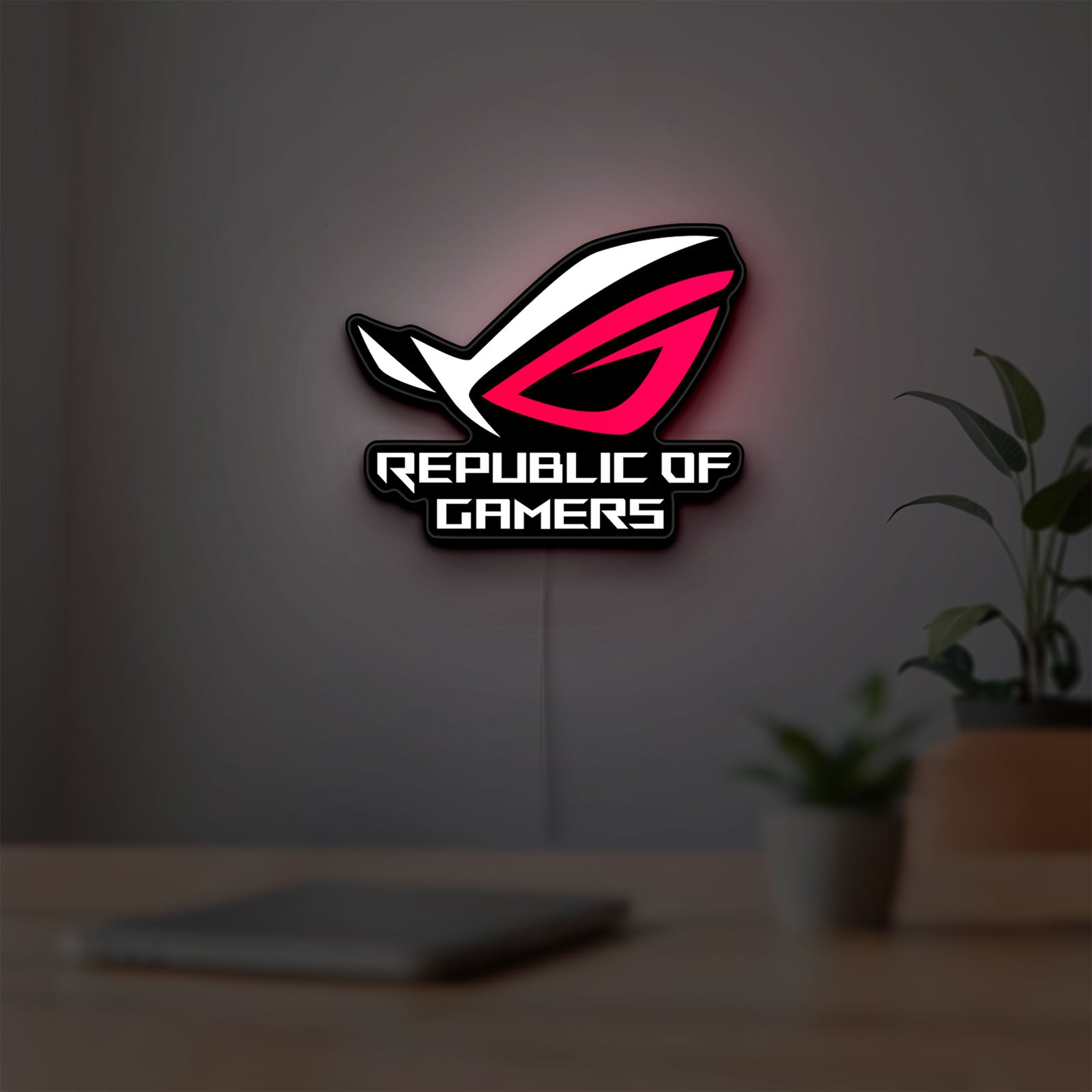 Republic Of Gamers New LED lightbox hanging on a room wall with soft white light