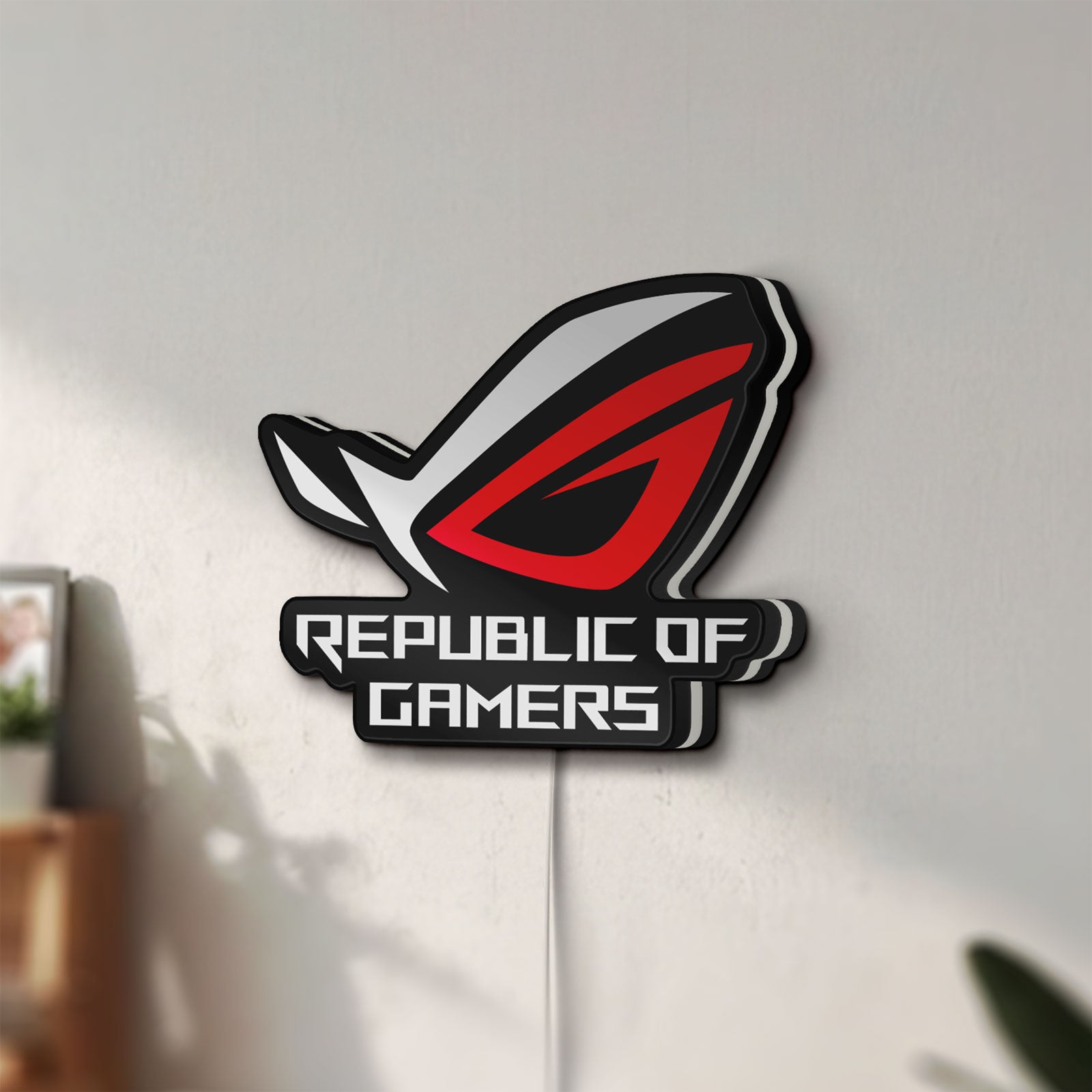 Unlit Republic Of Gamers New LED lightbox mounted on a wall in daylight