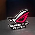 Republic Of Gamers New LED lightbox standing on a desk from an angled side view with white glow