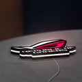 Republic Of Gamers New LED lightbox lying flat on a desk with white glow
