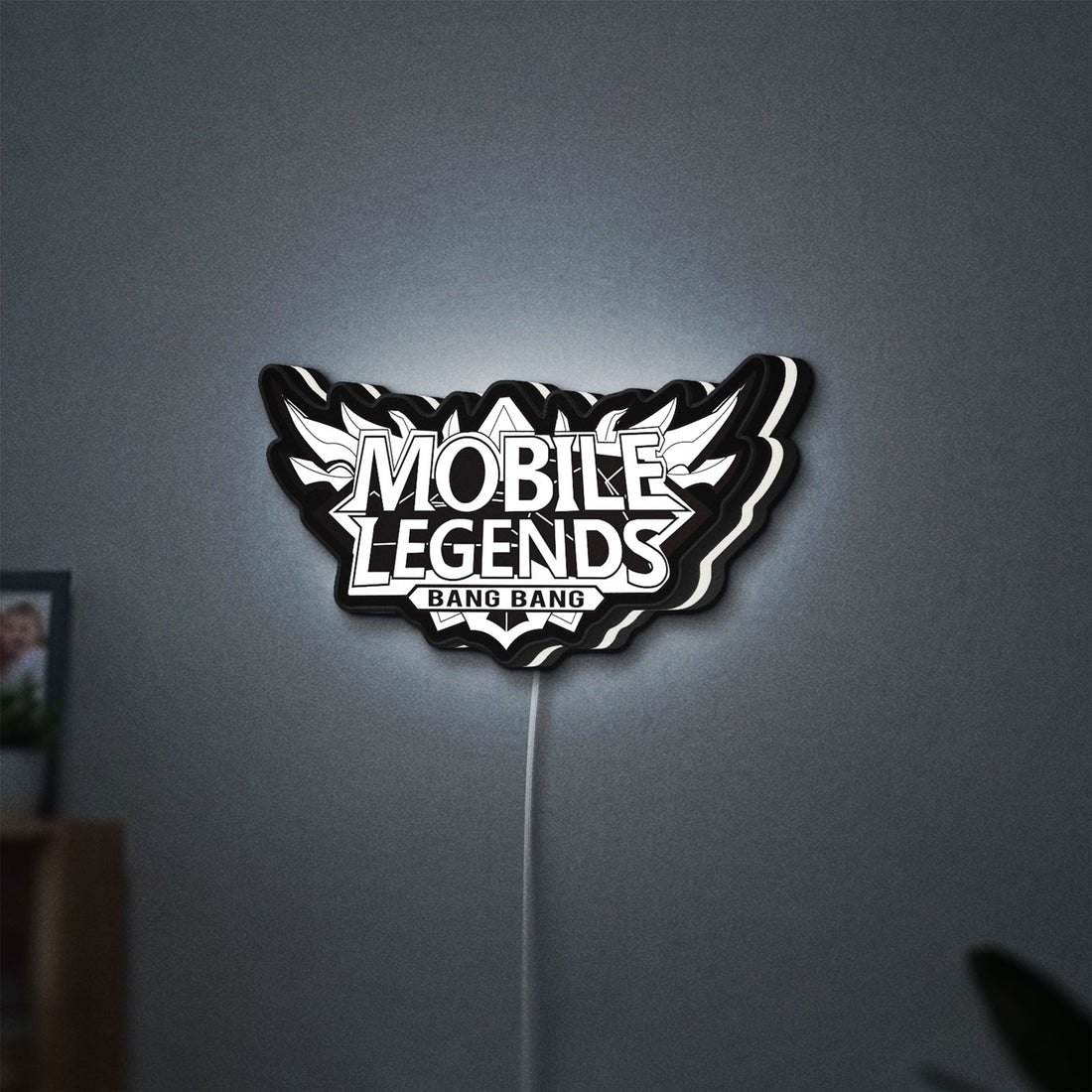 Mobile Legends Bang Bang LED lightbox hanging on a wall with white glow