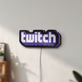 Unlit Twitch LED lightbox mounted on a wall in daylight