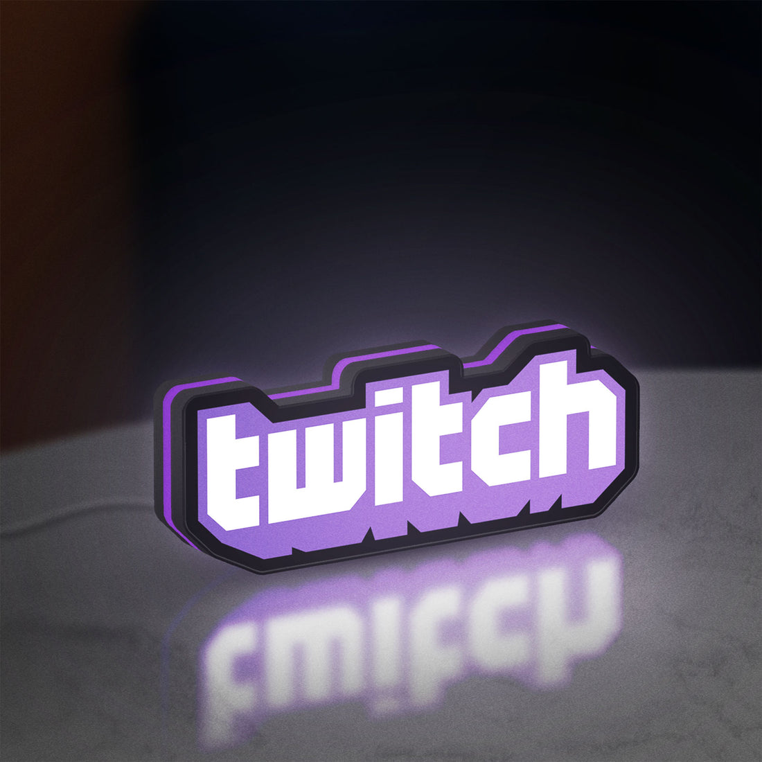 Twitch LED lightbox hanging on a wall with purple glow