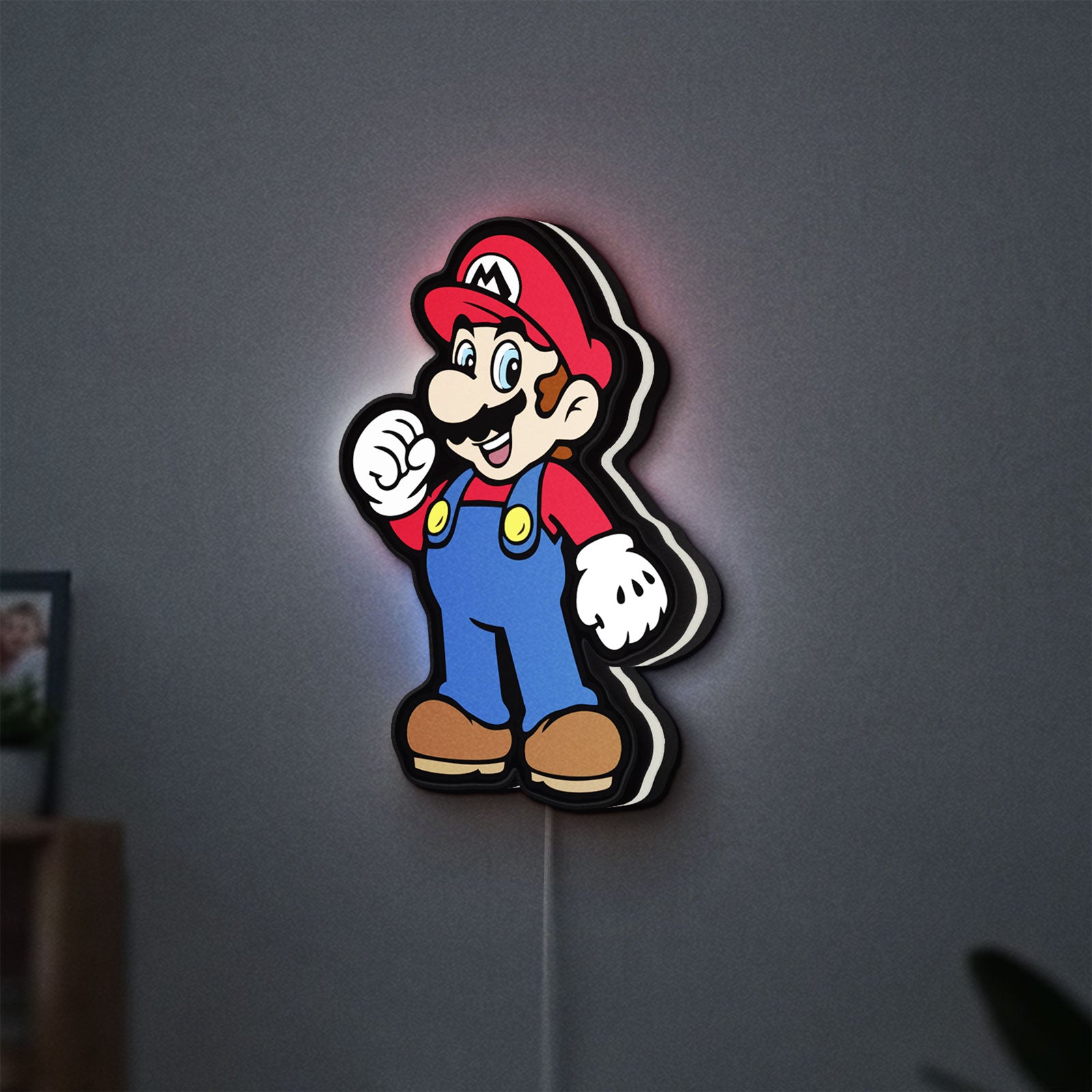 Super Mario LED lightbox hanging on a wall with white glow