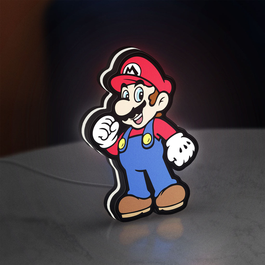 Super Mario LED lightbox hanging on a wall with white glow