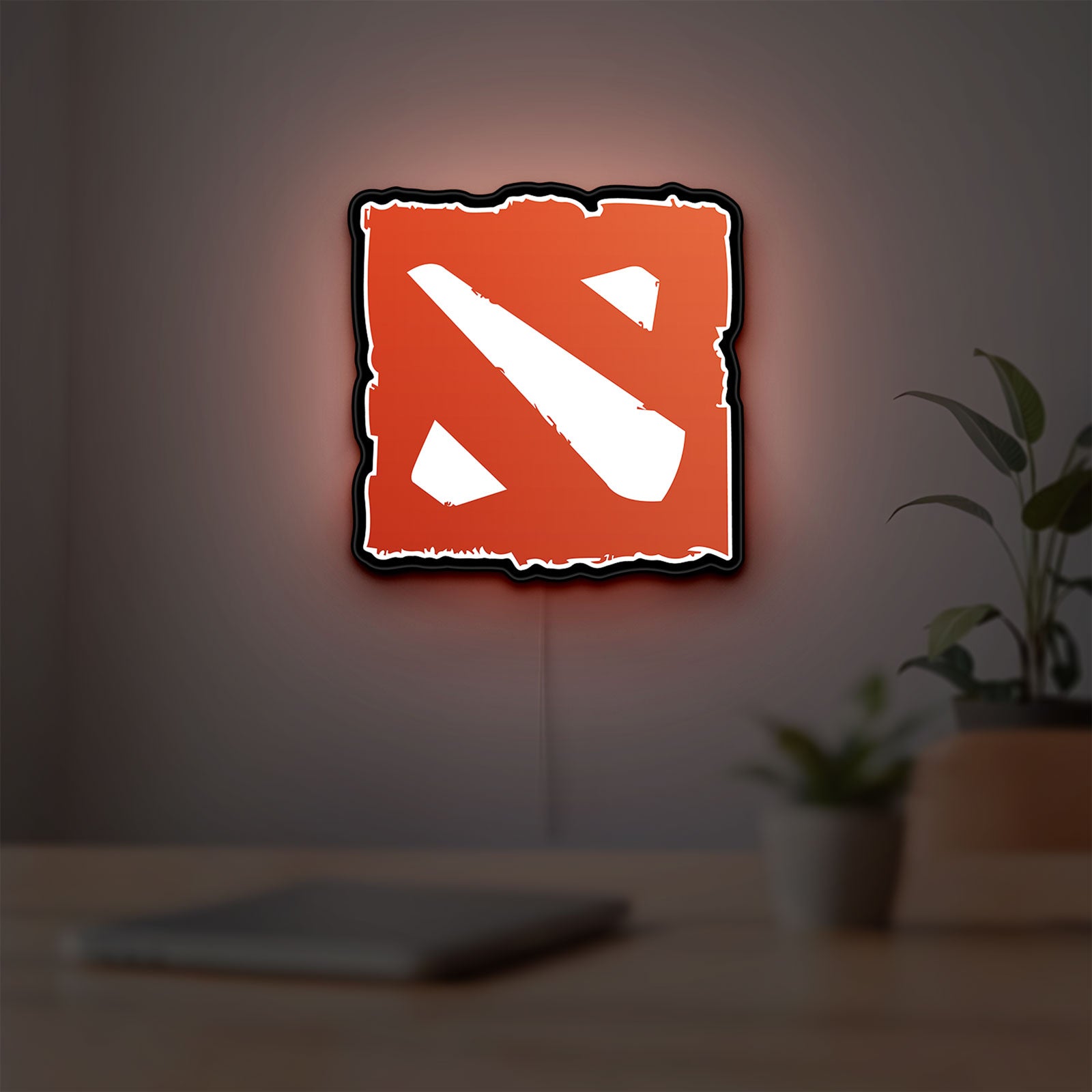 Dota LED lightbox hanging on a room wall with soft red light