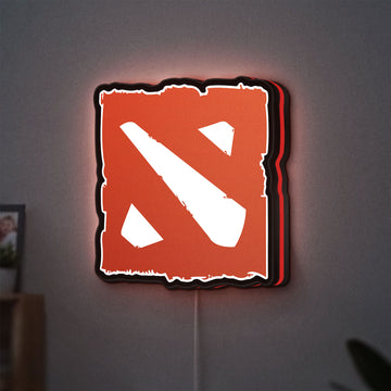 Dota LED lightbox hanging on a wall with red glow