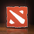 Front view of Dota LED lightbox sign glowing on a wooden desk