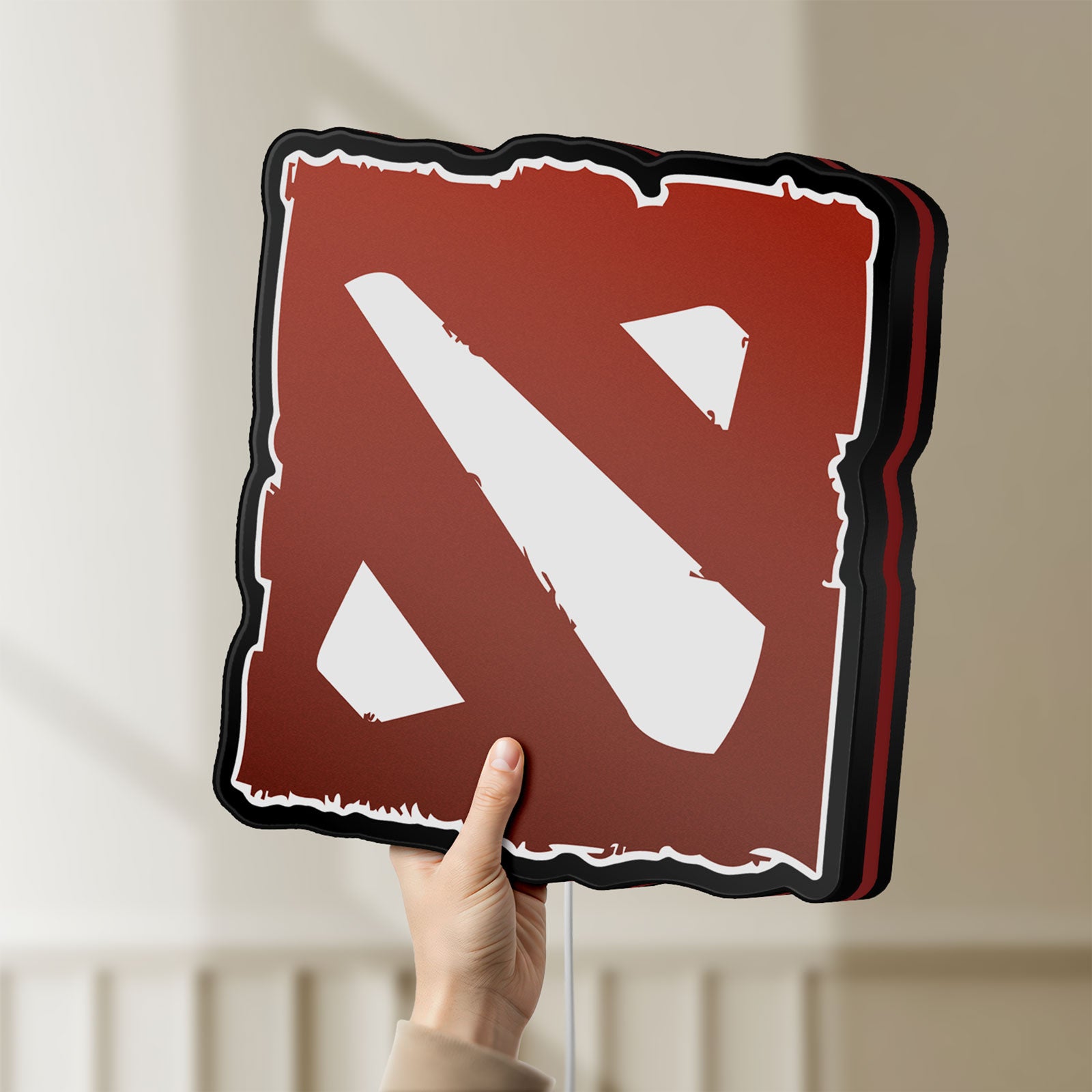 Unlit Dota LED lightbox held by hand to show size and details