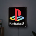 PLAYSTATION 2 LED lightbox hanging on a wall with white glow