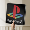 Unlit PLAYSTATION 2 LED lightbox held by hand to show size and details
