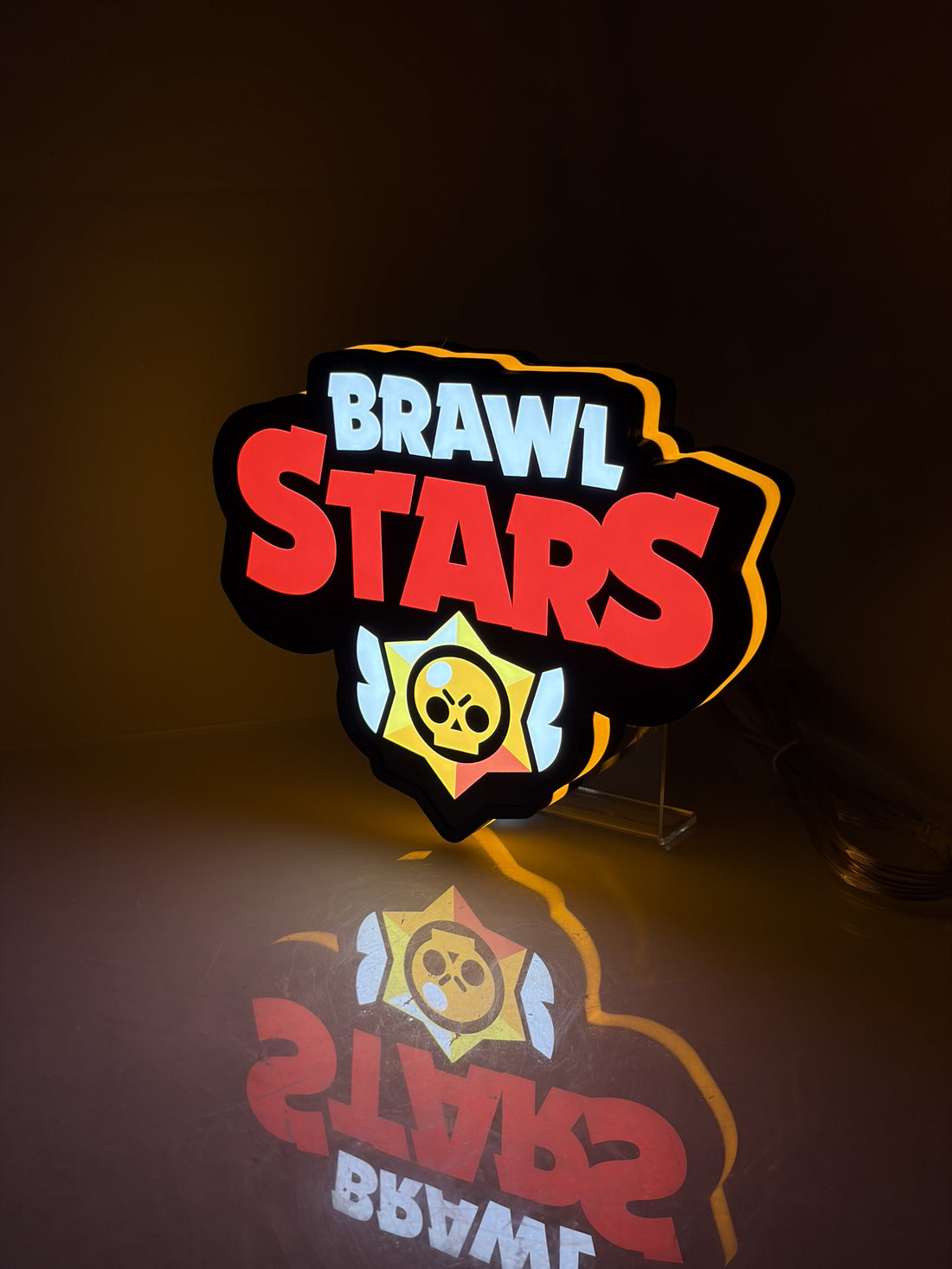 Angled view of the glowing Brawl Stars1 3D LED lightbox, showing its side housing on a tabletop