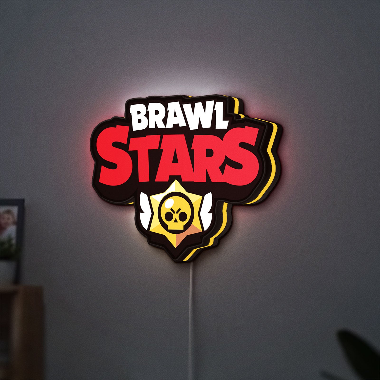 Brawl Stars LED lightbox hanging on a wall with yellow glow