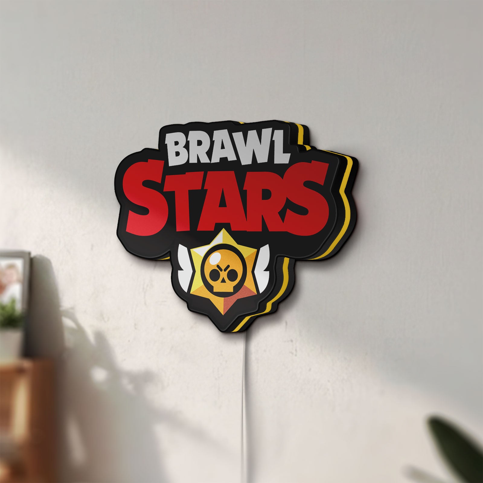 Unlit Brawl Stars LED lightbox mounted on a wall in daylight