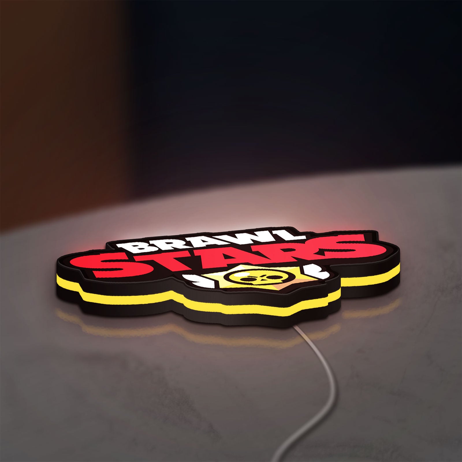 Brawl Stars LED lightbox lying flat on a desk with yellow glow