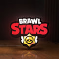 Front view of Brawl Stars LED lightbox sign glowing on a wooden desk
