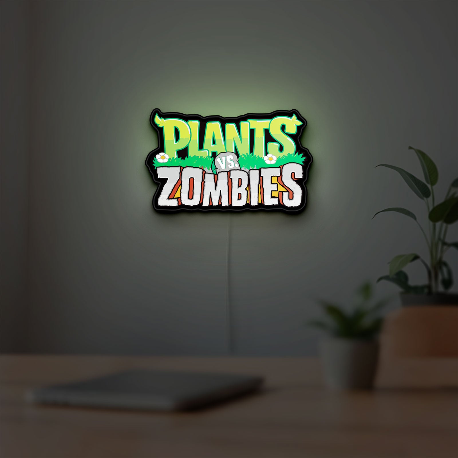 Plants vs Zombies LED lightbox hanging on a room wall with soft green light