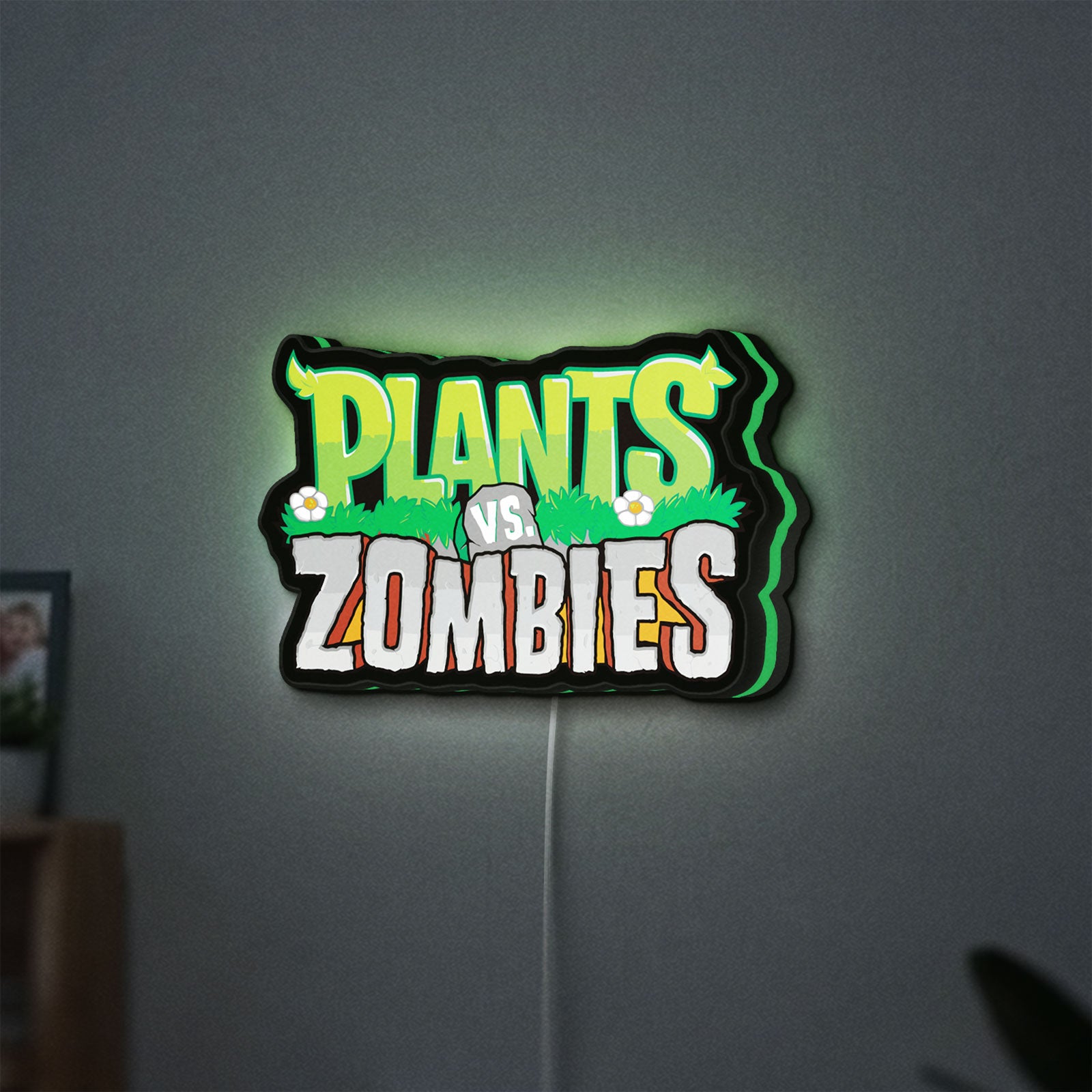 Plants vs Zombies LED lightbox hanging on a wall with green glow