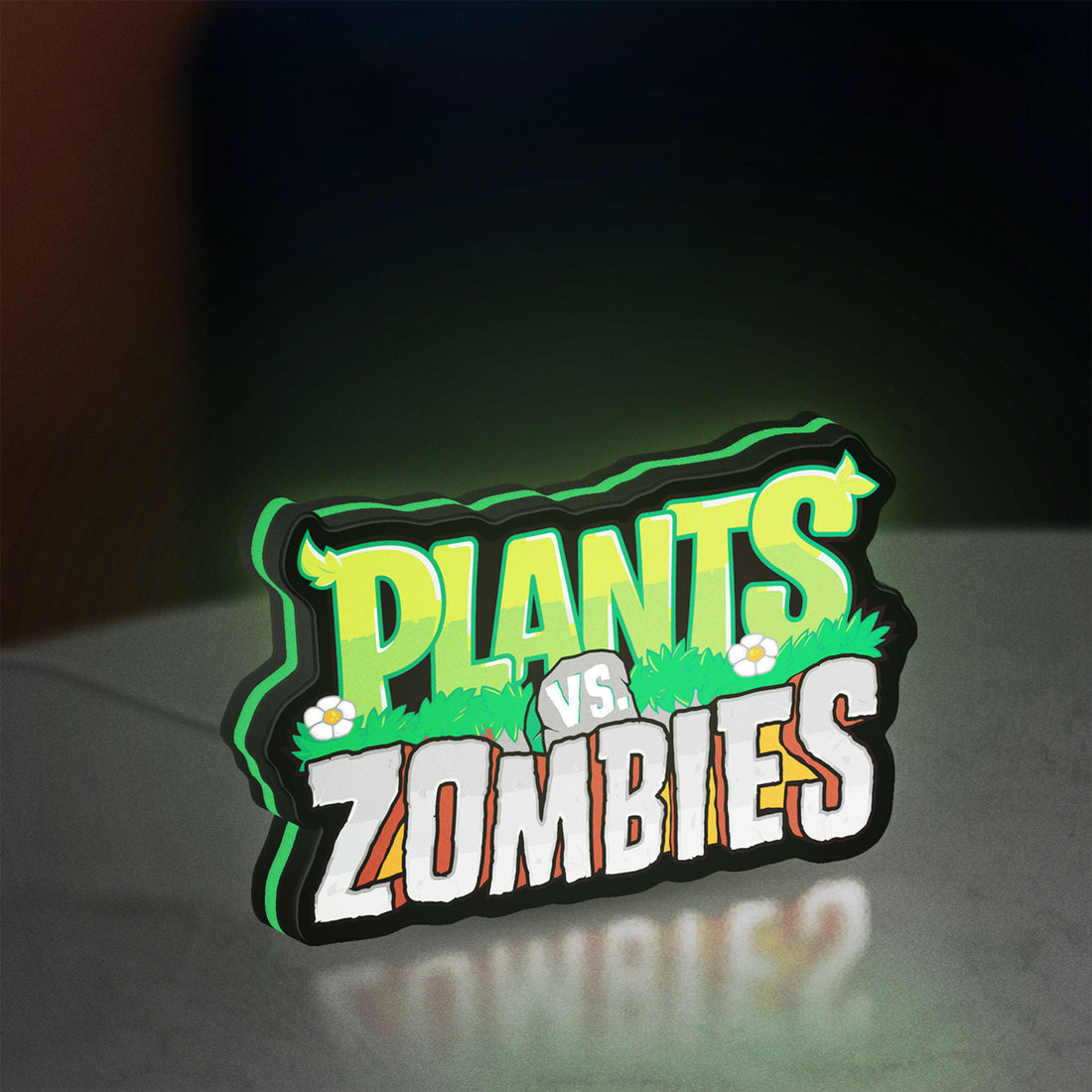 Plants vs Zombies LED lightbox hanging on a wall with green glow