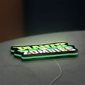 Plants vs Zombies LED lightbox lying flat on a desk with green glow