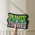 Unlit Plants vs Zombies LED lightbox held by hand to show size and details