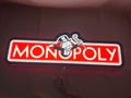 Illuminated flat lay front view of Monopoly Money Bag Illuminated Sign in 60cm, unique wall art for desk and room decor