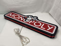 Unlit flat lay angled details of Monopoly Money Bag 3D LED Sign in 60cm, unique wall art for desk and room decor