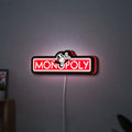 Monopoly Money Bag LED lightbox hanging on a wall with red glow