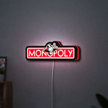 Monopoly Money Bag LED lightbox hanging on a wall with red glow