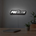 Need for Speed Prostreet Sign LED lightbox hanging on a room wall with soft white light