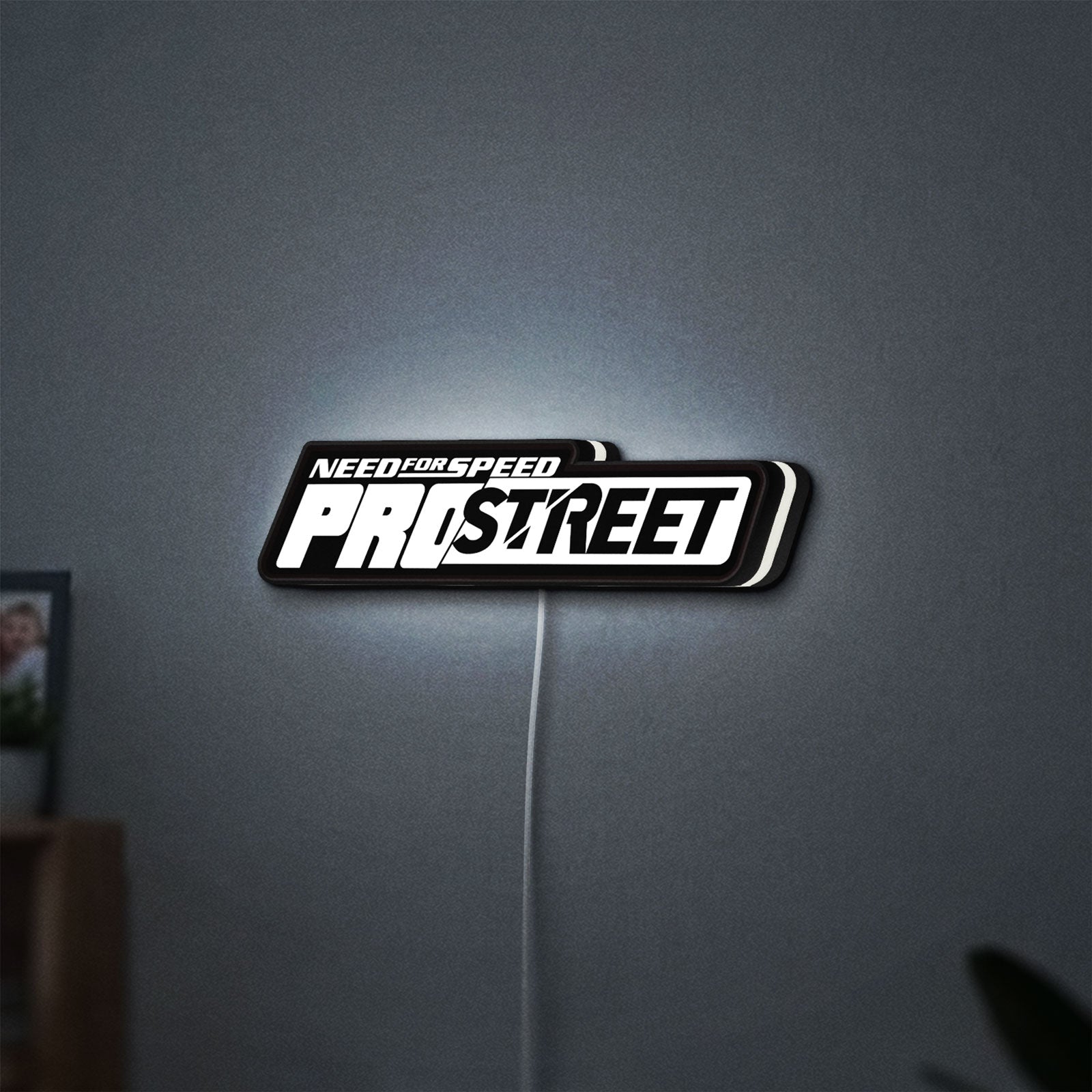 Need for Speed Prostreet Sign LED lightbox hanging on a wall with white glow
