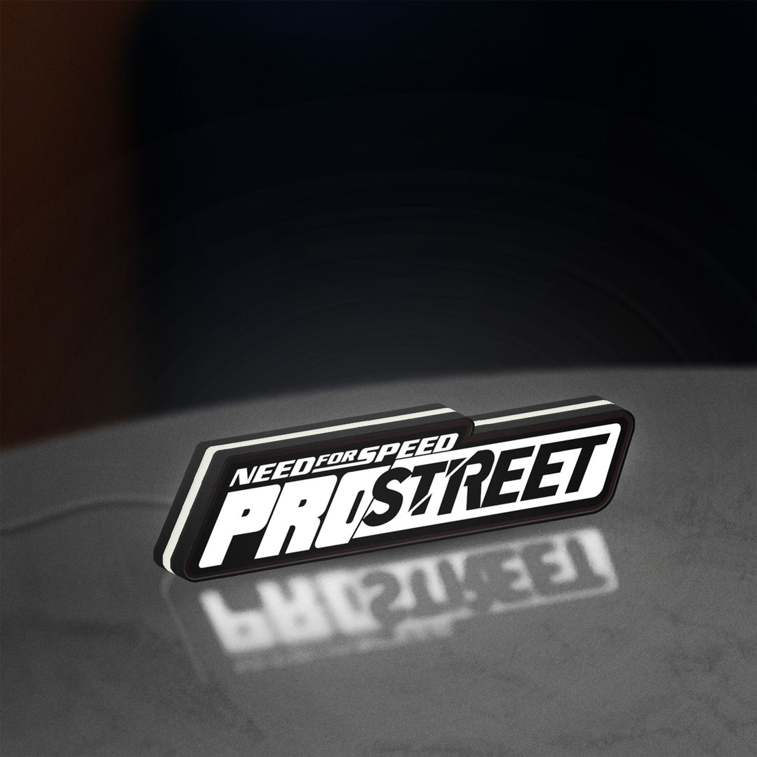 Need for Speed Prostreet Sign LED lightbox hanging on a wall with white glow