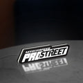 Need for Speed Prostreet Sign LED lightbox standing on a desk from an angled side view with white glow